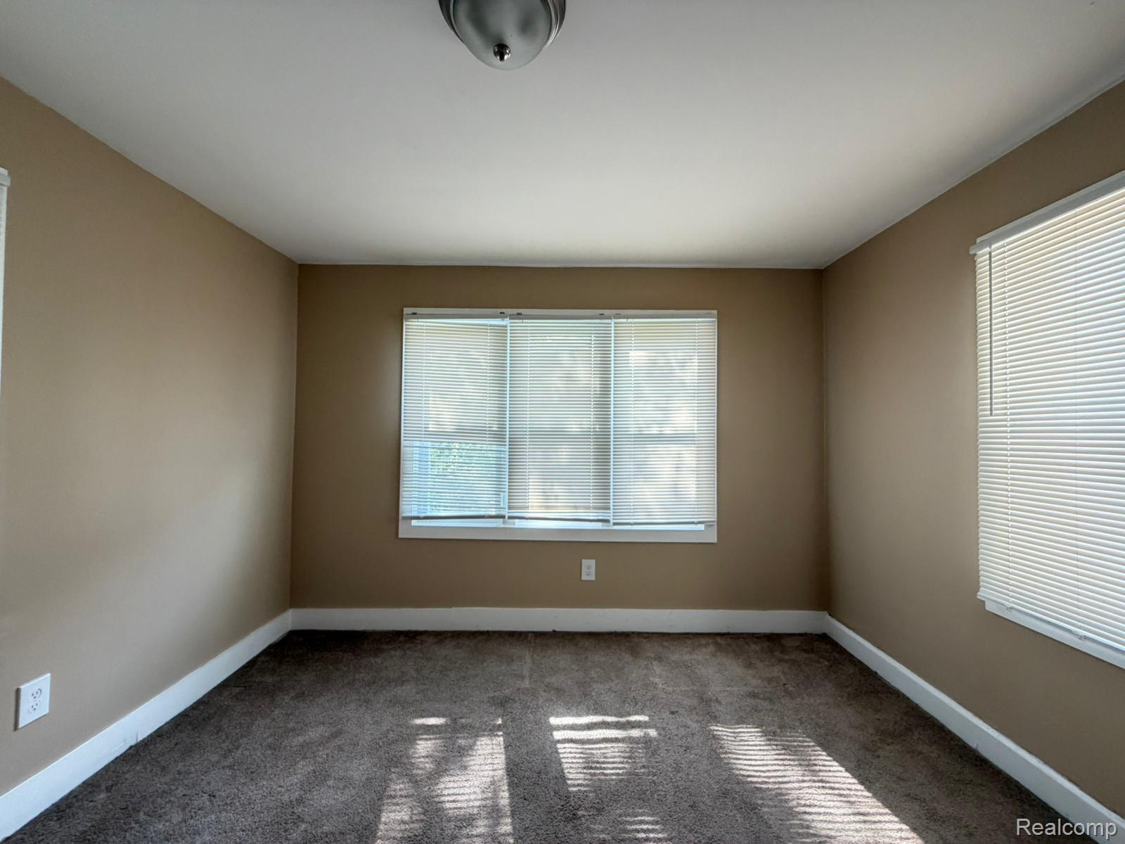 15935 Normandy Street Detroit, MI 48238 - Photo 24 of 28 Carpeted room with a neutral wall color, white baseboards, and a white ceiling