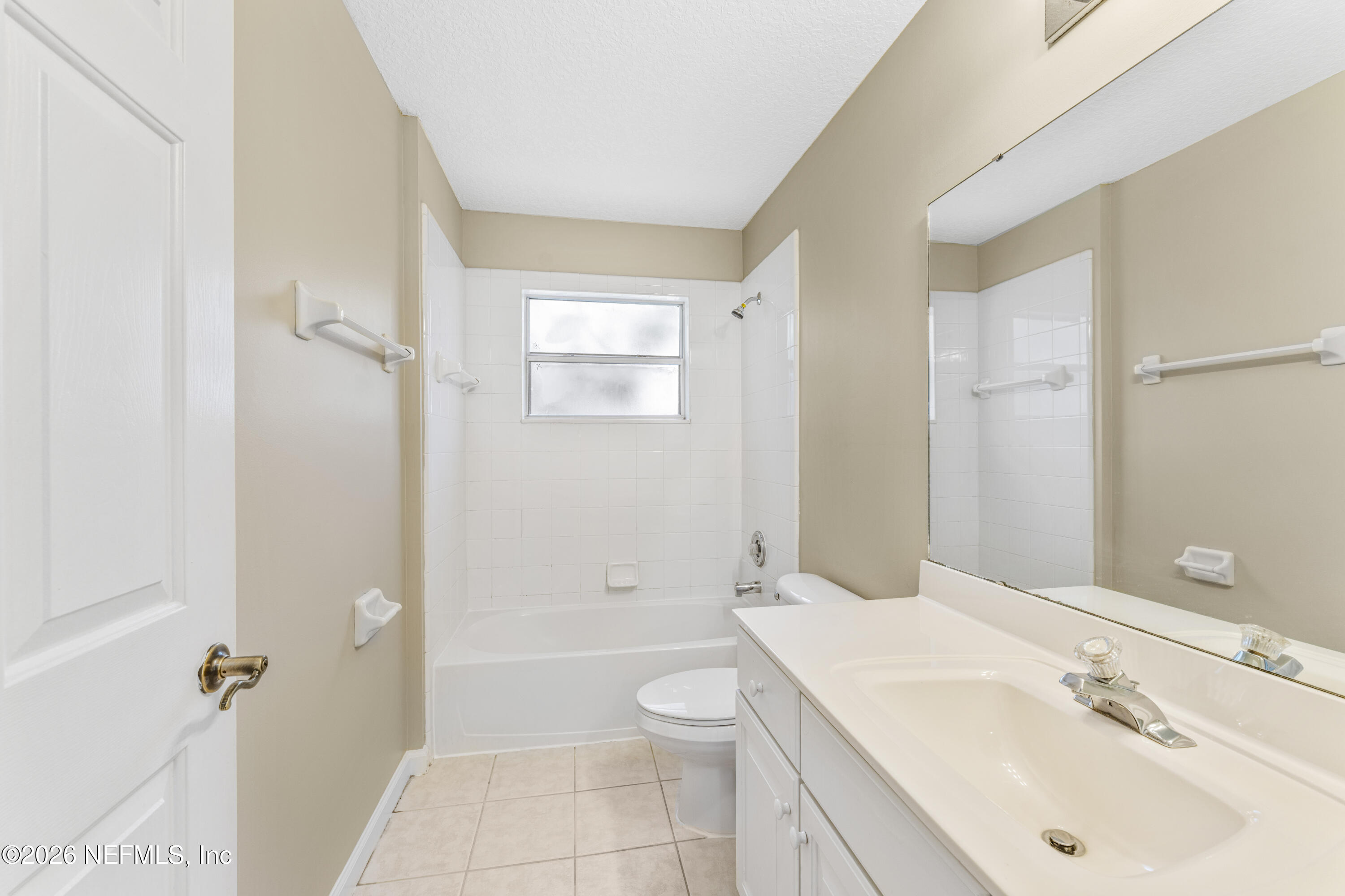 1896 Bluebonnet Way Fleming Island, FL 32003 - Photo 15 of 28 a bathroom with a sink a toilet and shower