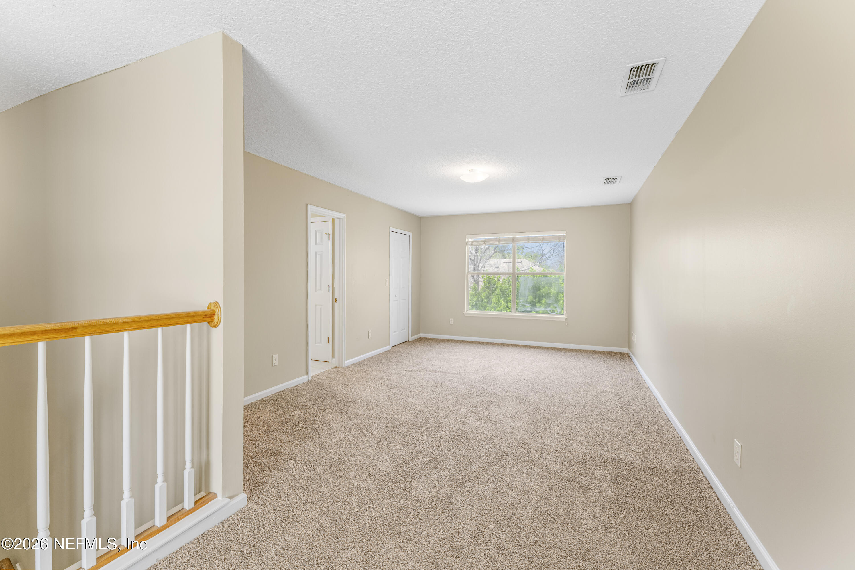 1896 Bluebonnet Way Fleming Island, FL 32003 - Photo 16 of 28 a view of an empty room with a window