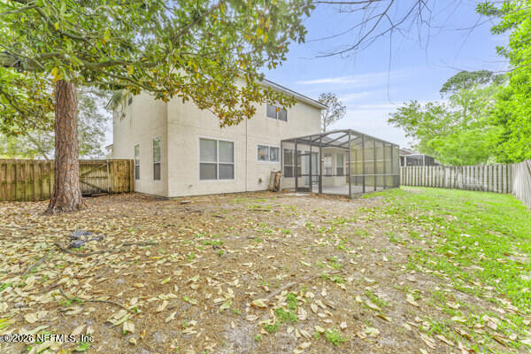 1896 Bluebonnet Way Fleming Island, FL 32003 - Photo 26 of 28 a front view of a house with a garden