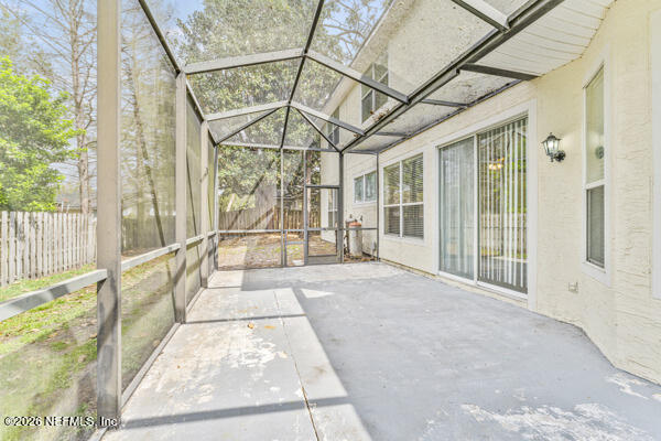 1896 Bluebonnet Way Fleming Island, FL 32003 - Photo 27 of 28 a view of a porch with a floor to ceiling windows