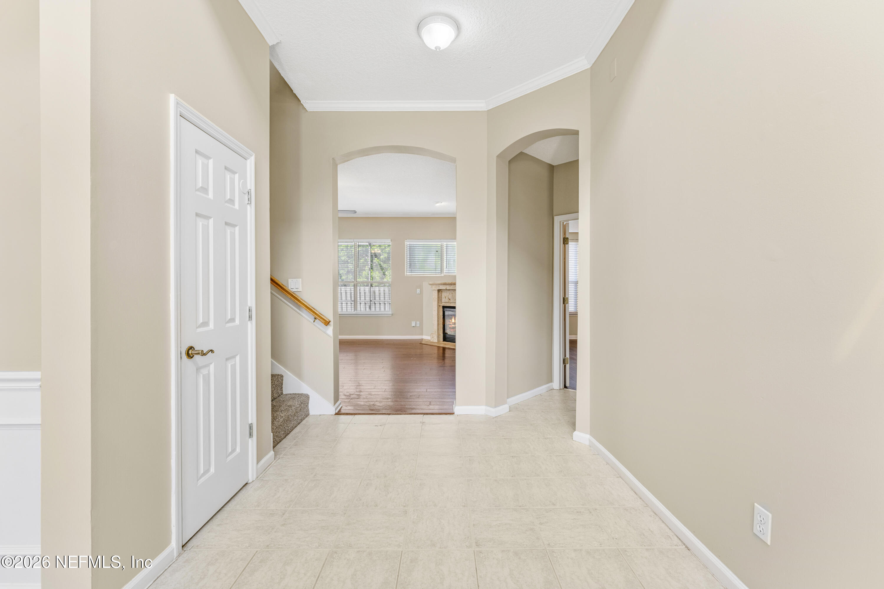 1896 Bluebonnet Way Fleming Island, FL 32003 - Photo 5 of 28 a view of a hallway with wooden floor and a living room