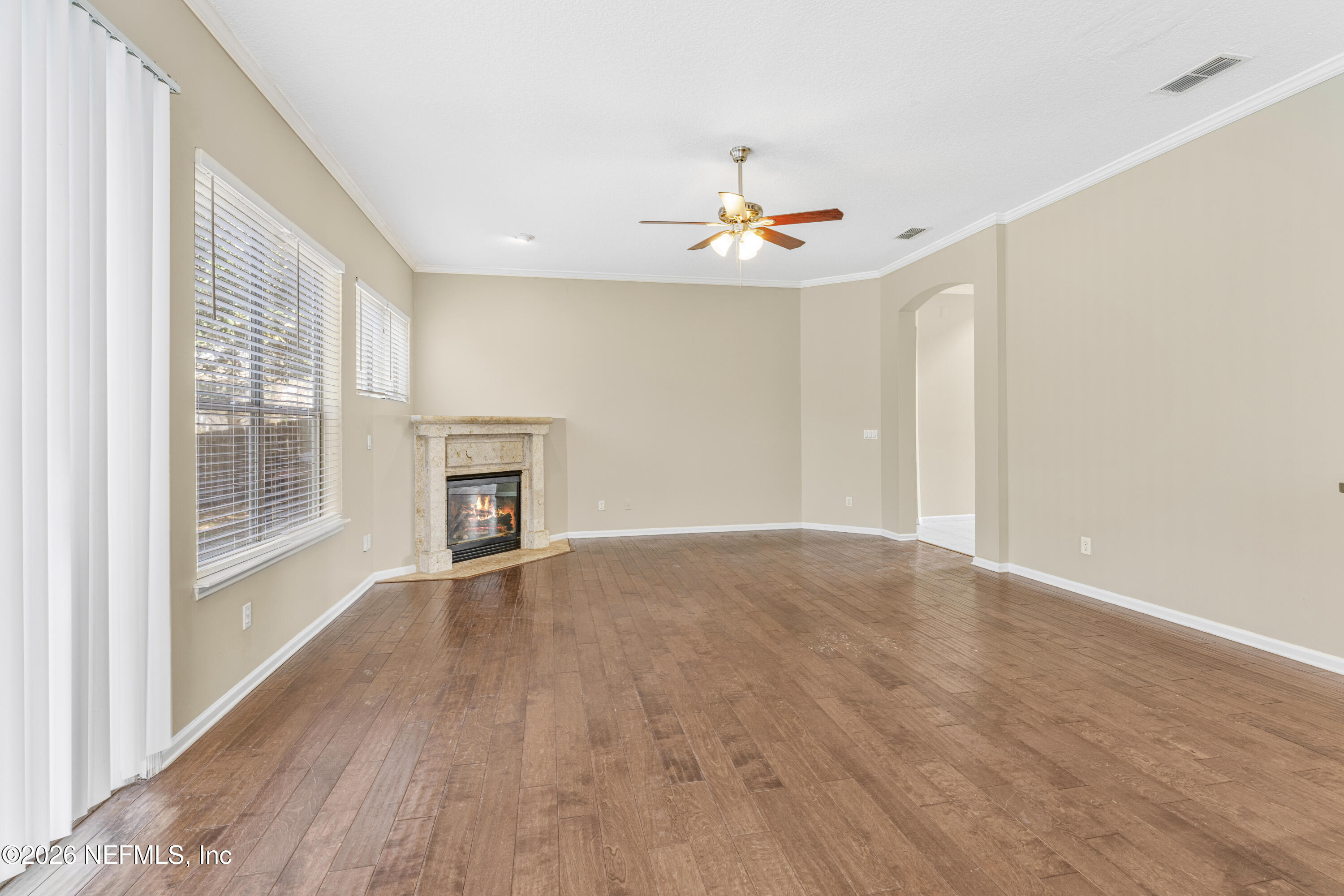 1896 Bluebonnet Way Fleming Island, FL 32003 - Photo 10 of 28 wooden floor in an empty room with a window