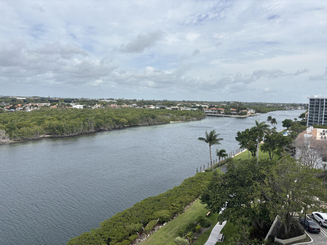 4201 North Ocean Boulevard, Unit 809 Boca Raton, FL 33431 - Photo 2 of 6 a view of a lake with houses in the back
