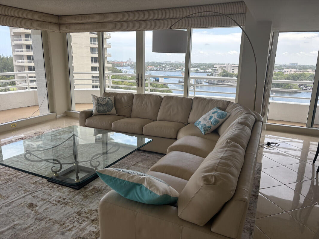 4201 North Ocean Boulevard, Unit 809 Boca Raton, FL 33431 - Photo 4 of 6 a living room with furniture and a large window