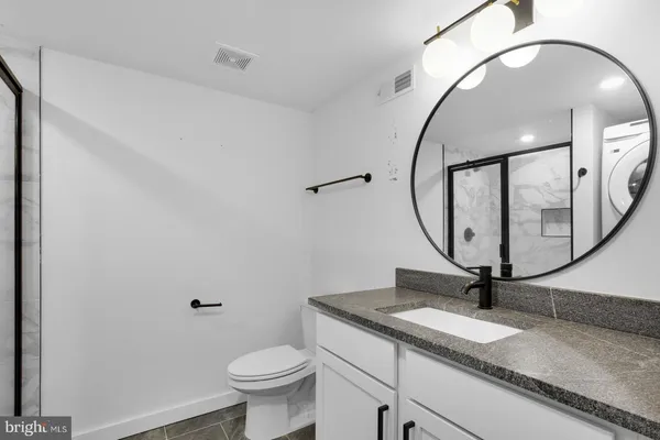 a view of a bathroom with a washer and dryer