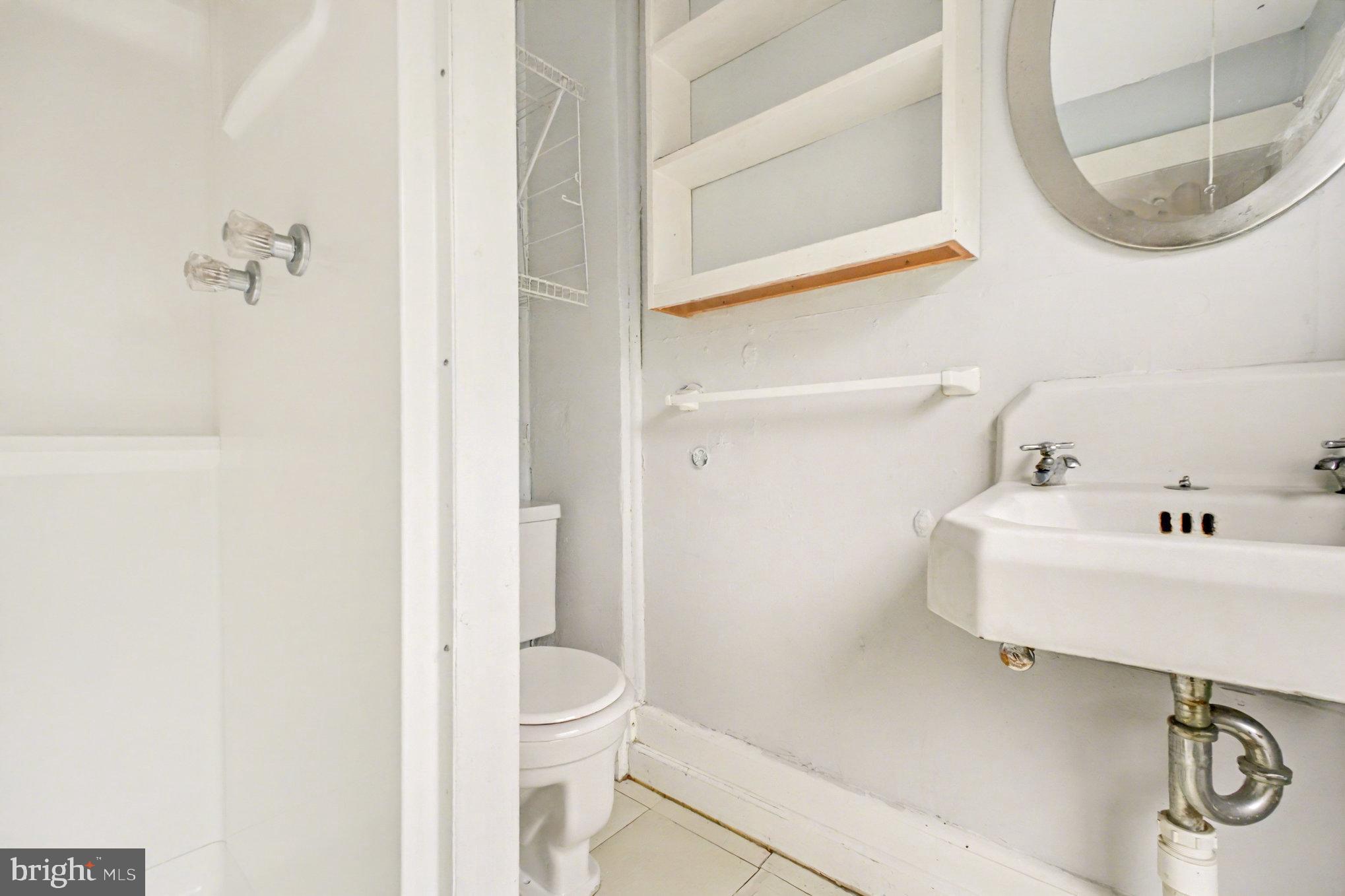 900 Ficklen Road Fredericksburg, VA 22405 - Photo 24 of 46 a bathroom with a sink and a mirror