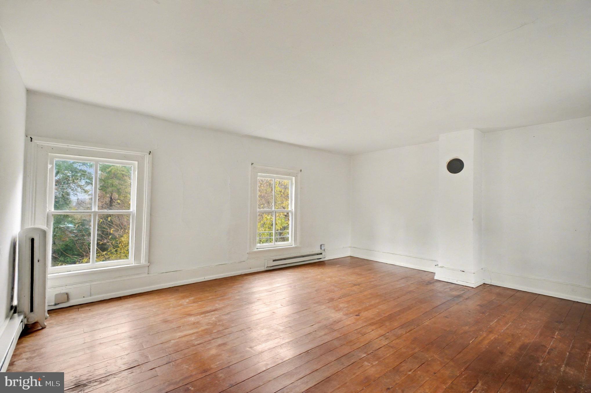900 Ficklen Road Fredericksburg, VA 22405 - Photo 29 of 46 an empty room with wooden floor and windows