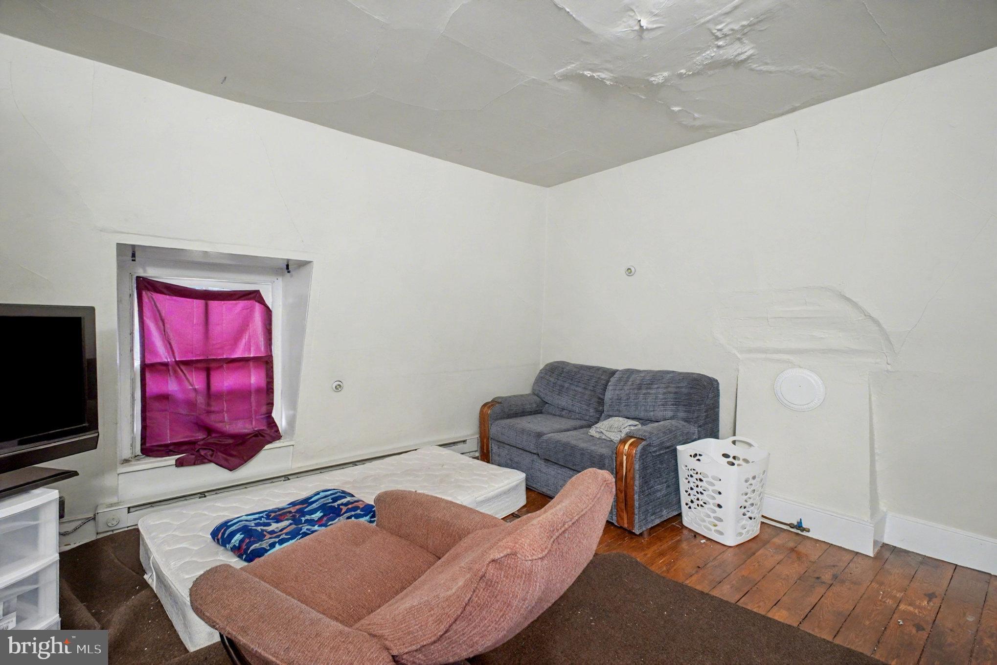 900 Ficklen Road Fredericksburg, VA 22405 - Photo 37 of 46 a living room with furniture and a flat screen tv