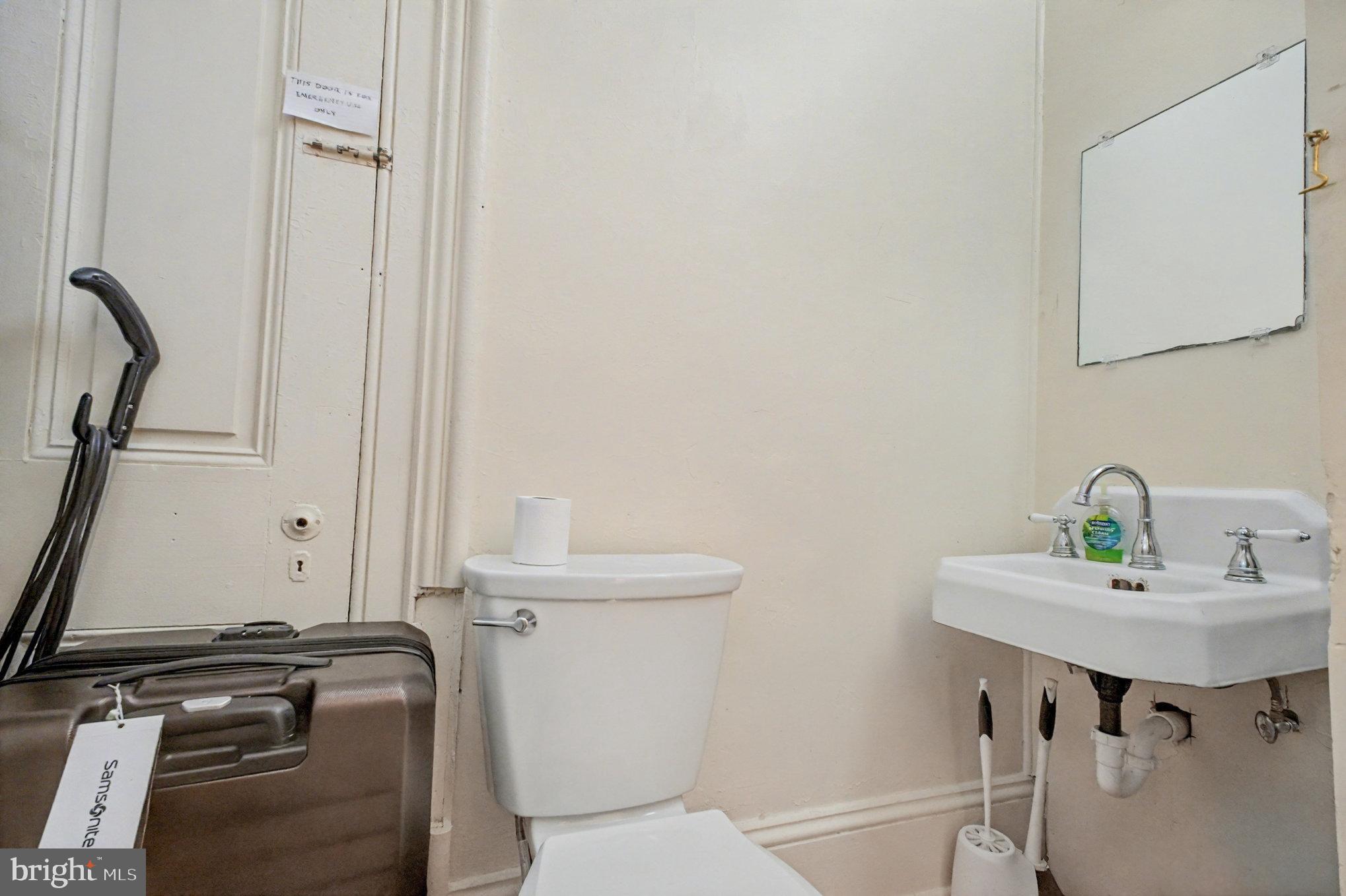 900 Ficklen Road Fredericksburg, VA 22405 - Photo 46 of 46 a bathroom with a sink a toilet and a mirror