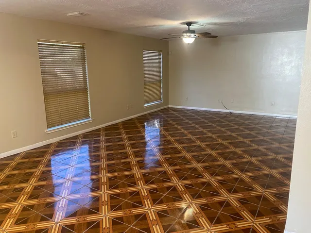 a kitchen with stainless steel appliances granite countertop a refrigerator and a stove