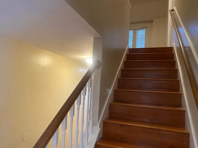 a view of bathroom with wooden floor