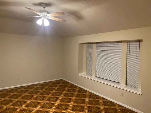 a white toilet sitting next to a white sink