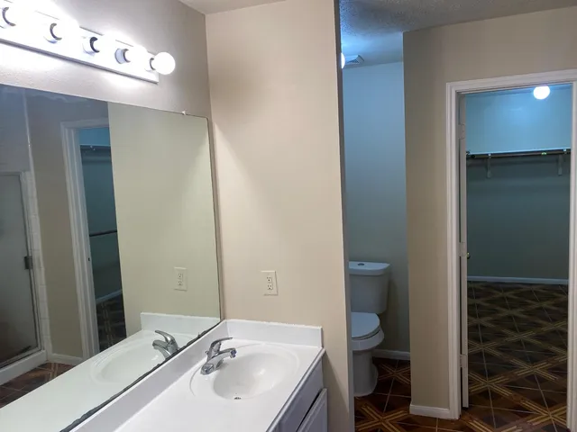 a bathroom with a tub and shower