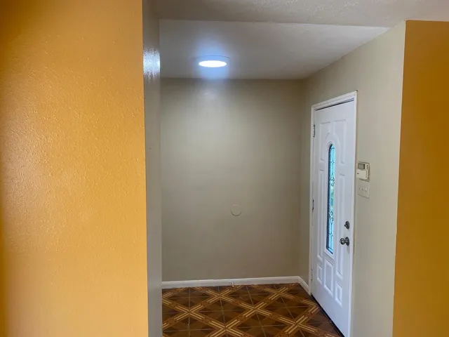 a view of an empty room with a window