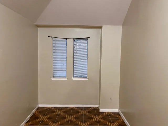 a kitchen with kitchen island granite countertop cabinets and stainless steel appliances