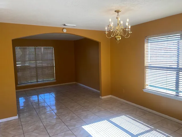 a view of hallway with windows