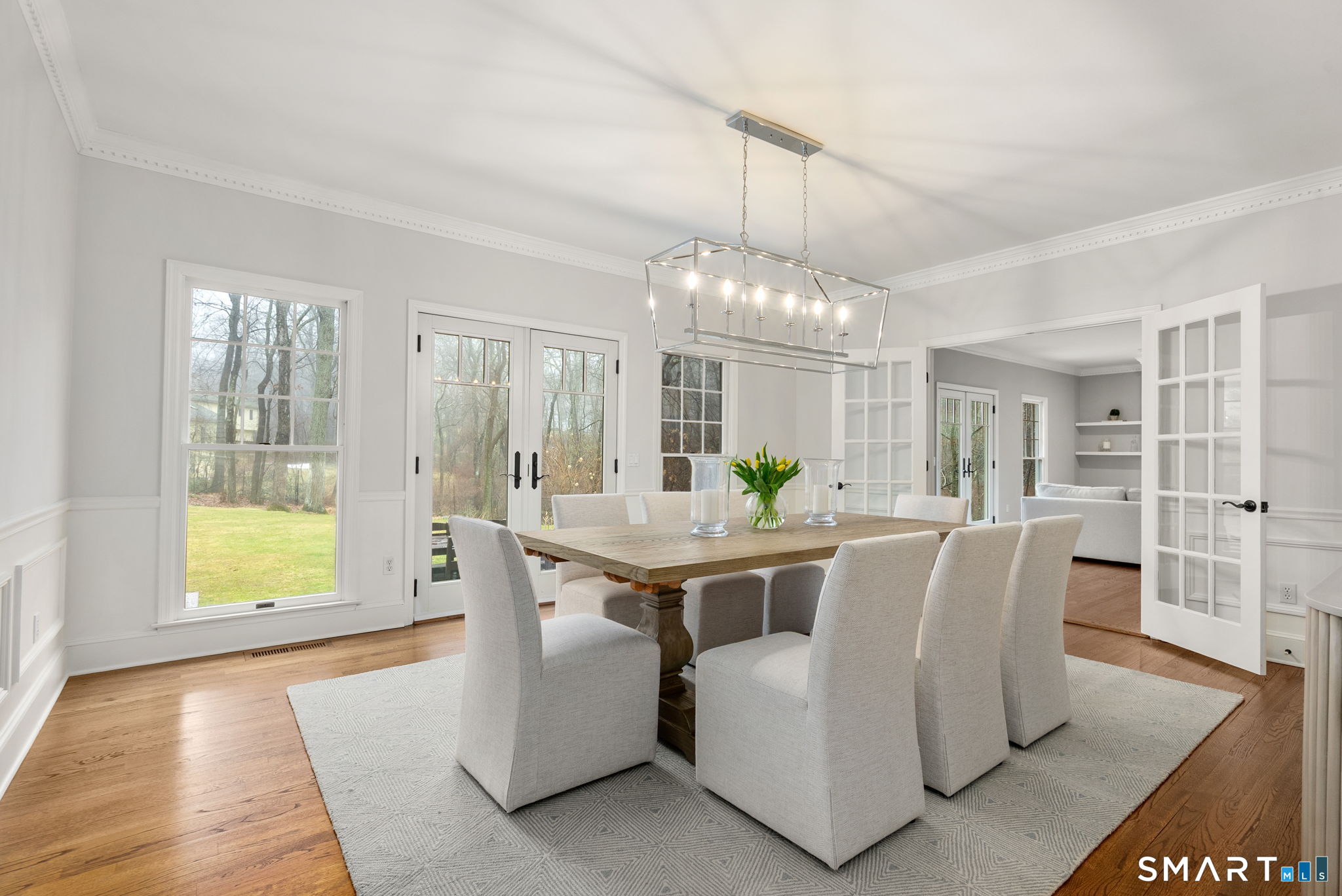 9 Pepperbush Road Weston, CT 06883 - Photo 15 of 48 a view of a dining room with furniture and a chandelier