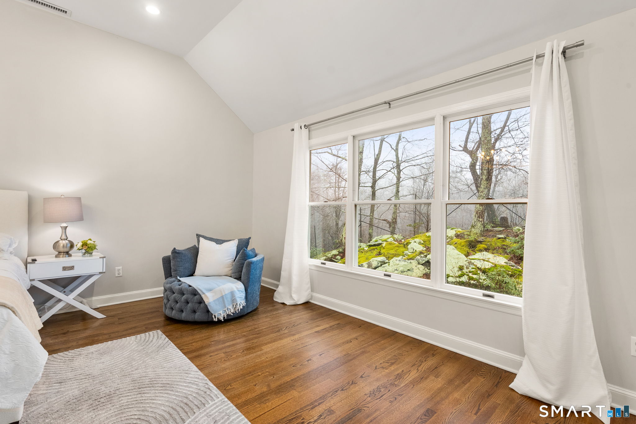 9 Pepperbush Road Weston, CT 06883 - Photo 19 of 48 a living room with furniture and a large window