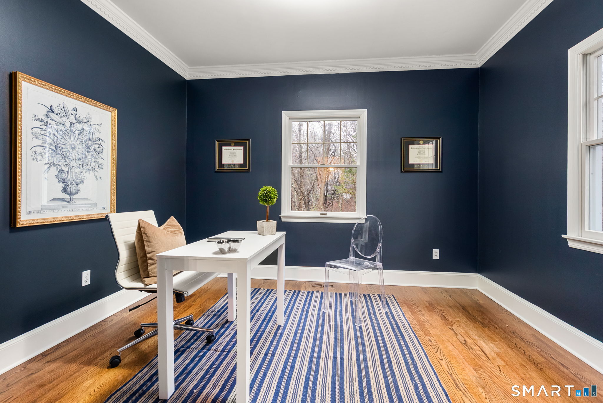 9 Pepperbush Road Weston, CT 06883 - Photo 20 of 48 a living room with a couch wooden floor and a table