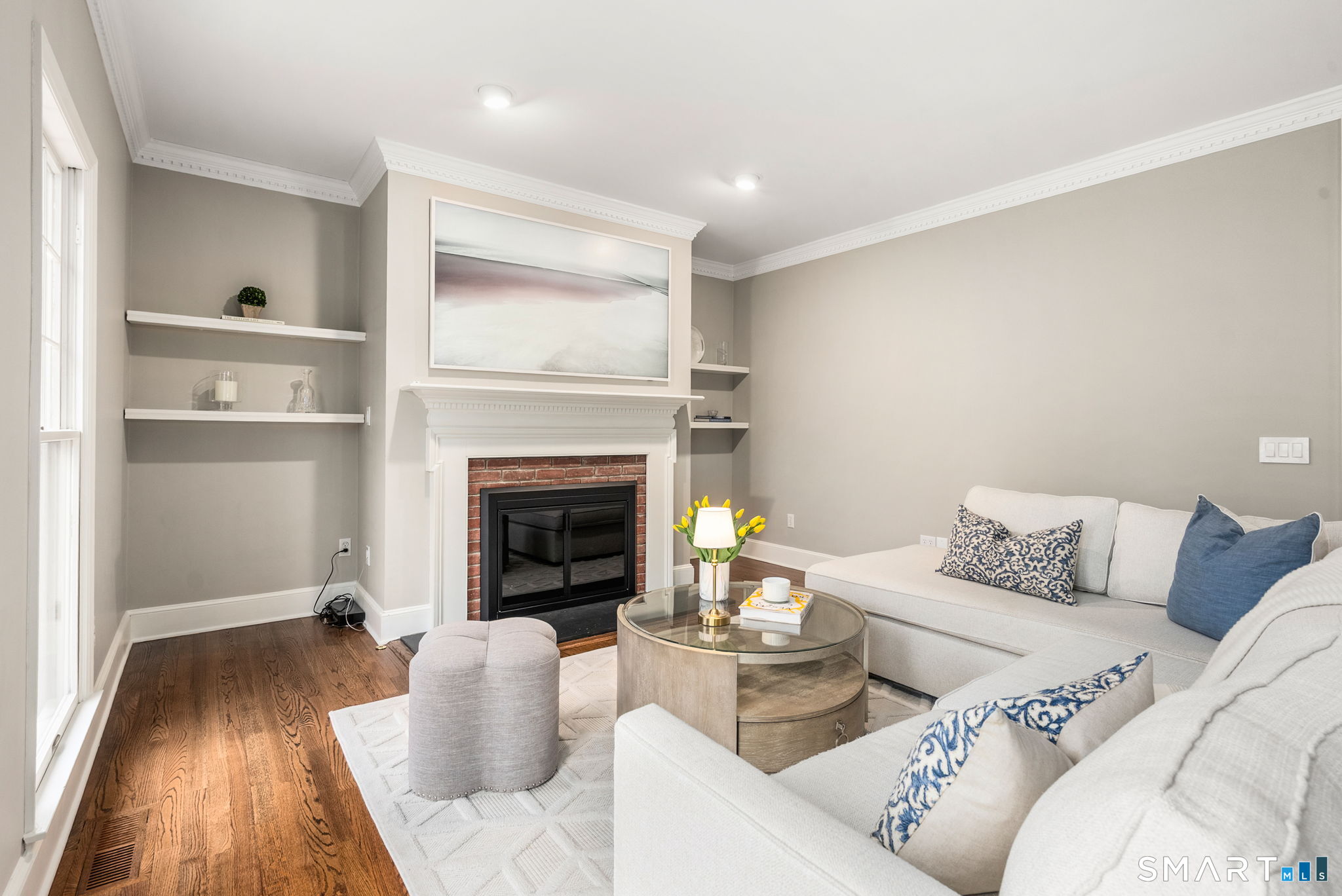 9 Pepperbush Road Weston, CT 06883 - Photo 24 of 48 a living room with furniture and a fireplace