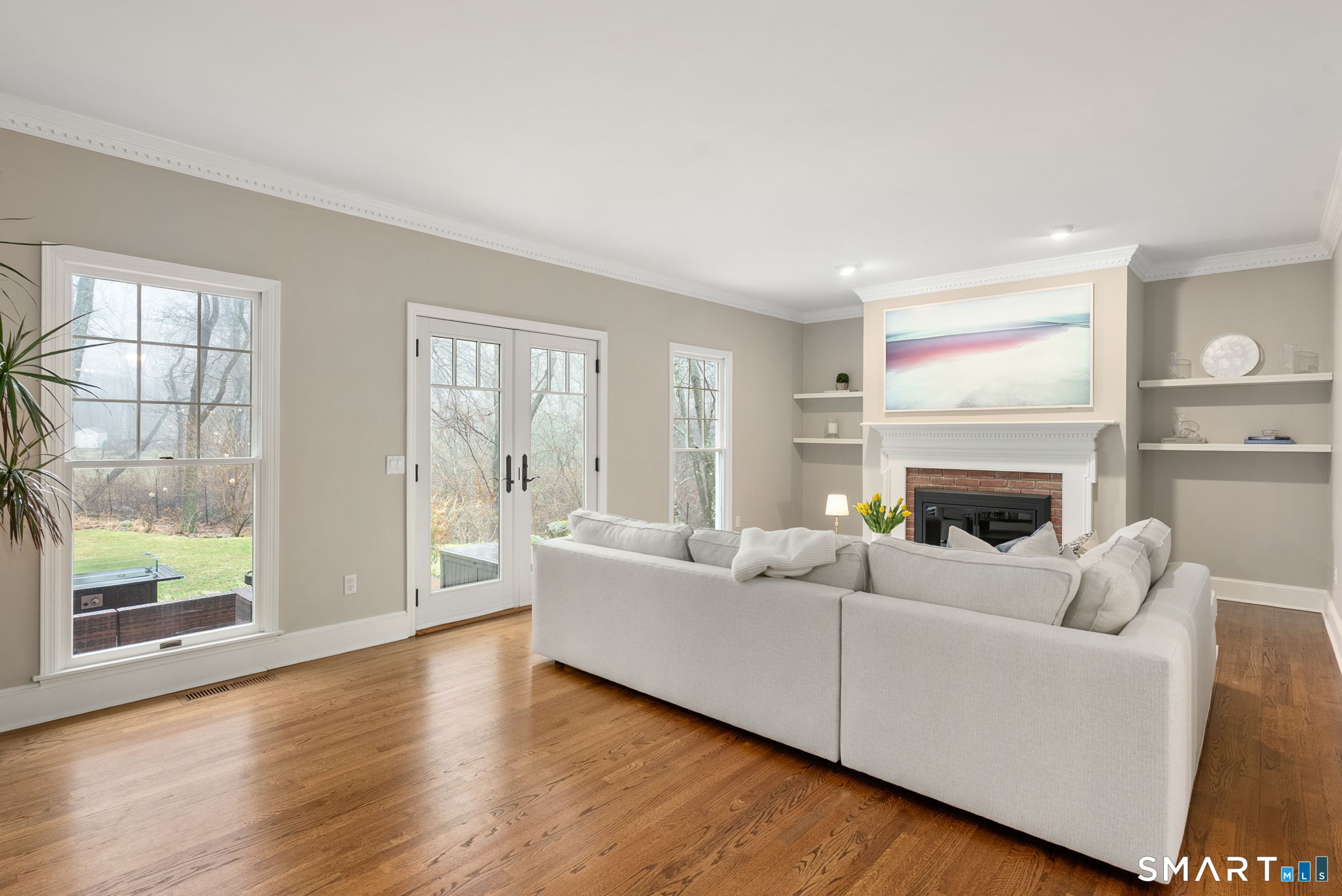 9 Pepperbush Road Weston, CT 06883 - Photo 25 of 48 a living room with furniture and a fireplace