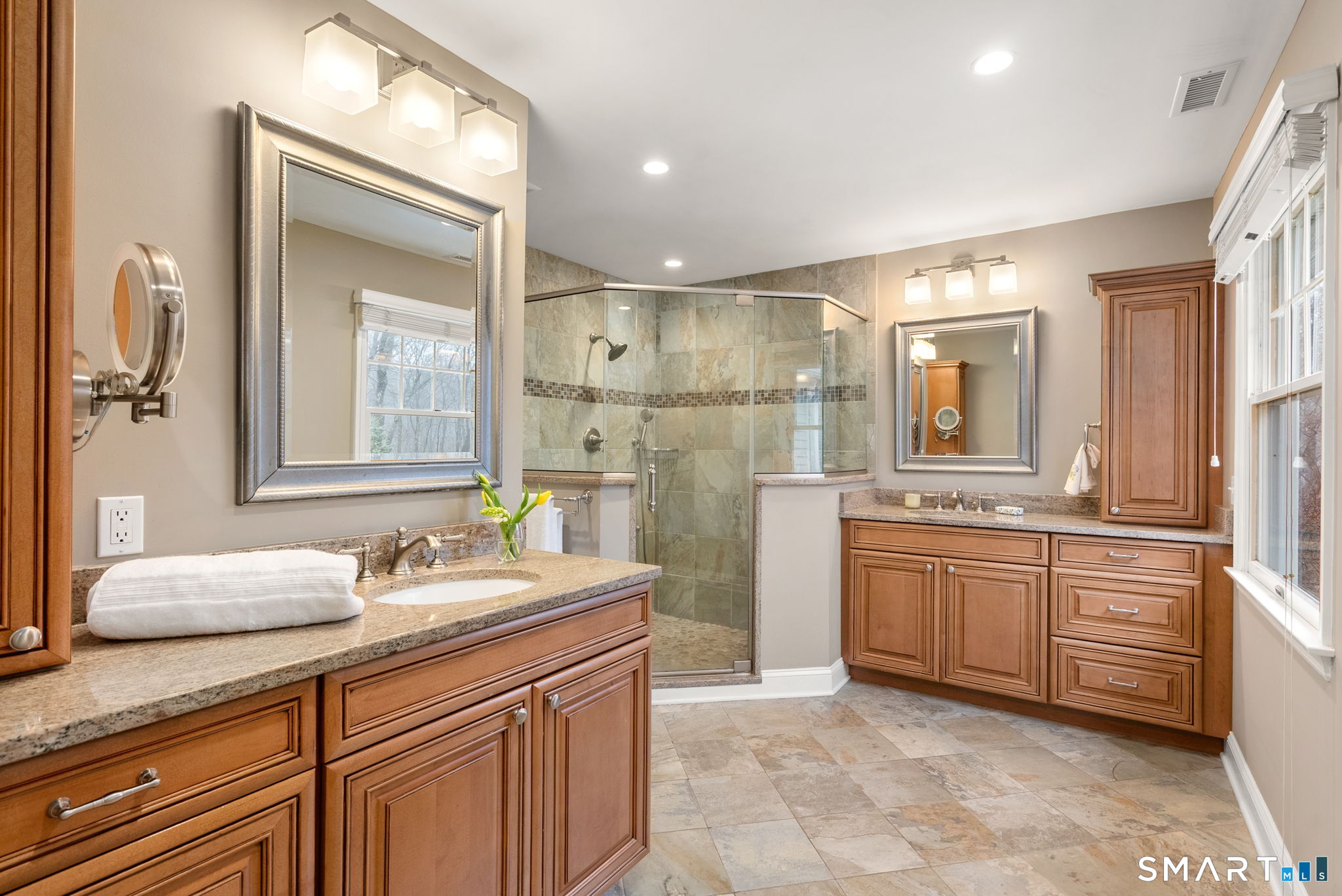 9 Pepperbush Road Weston, CT 06883 - Photo 29 of 48 a spacious bathroom with a granite countertop sink mirror and a
