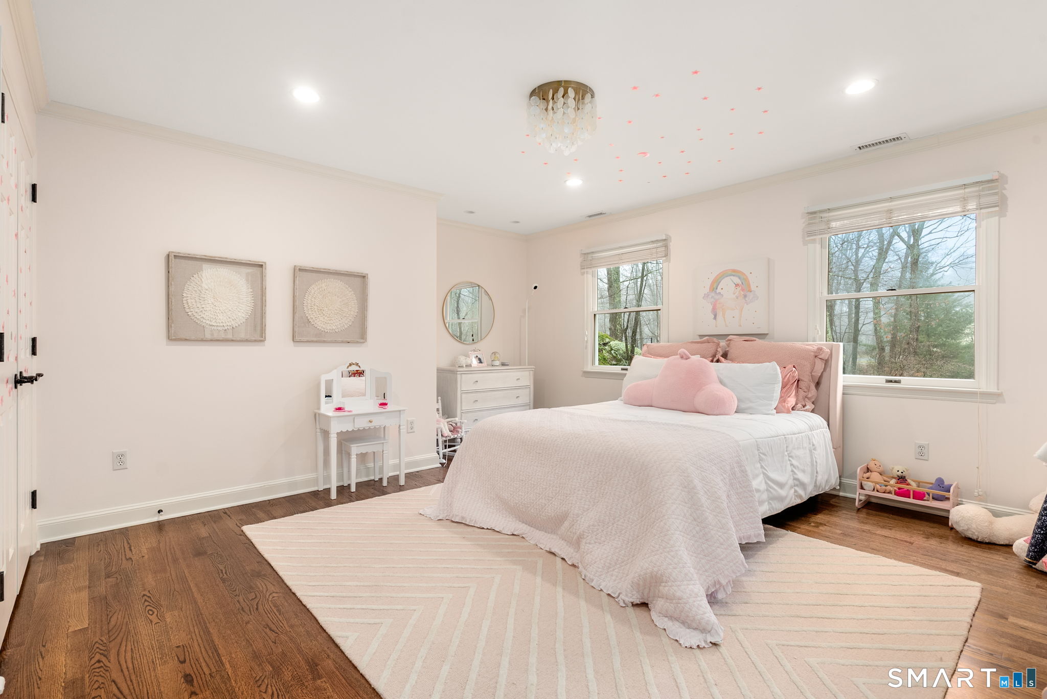 9 Pepperbush Road Weston, CT 06883 - Photo 30 of 48 a bedroom with a bed and wooden floor