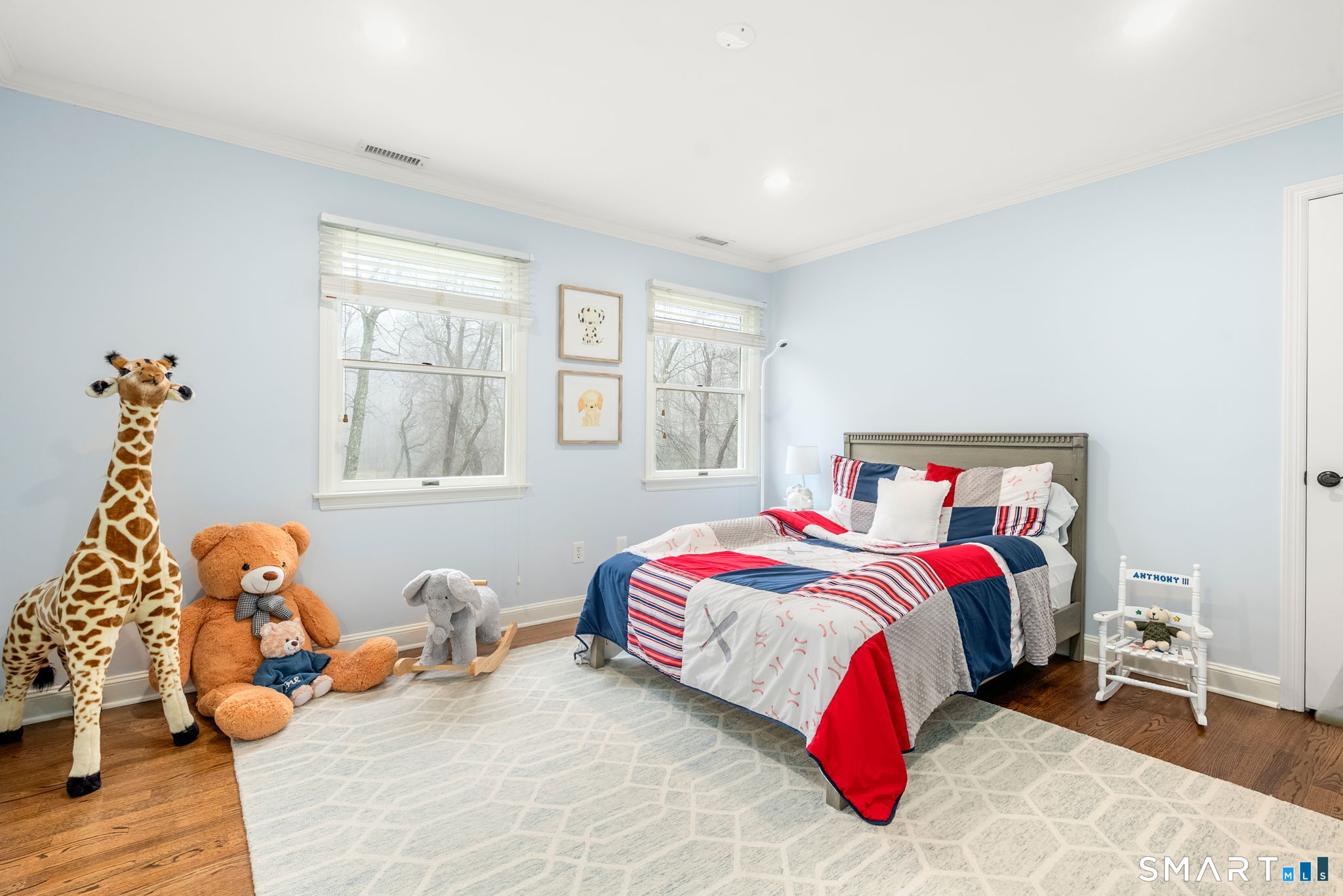 9 Pepperbush Road Weston, CT 06883 - Photo 33 of 48 a bedroom with a bed and a window