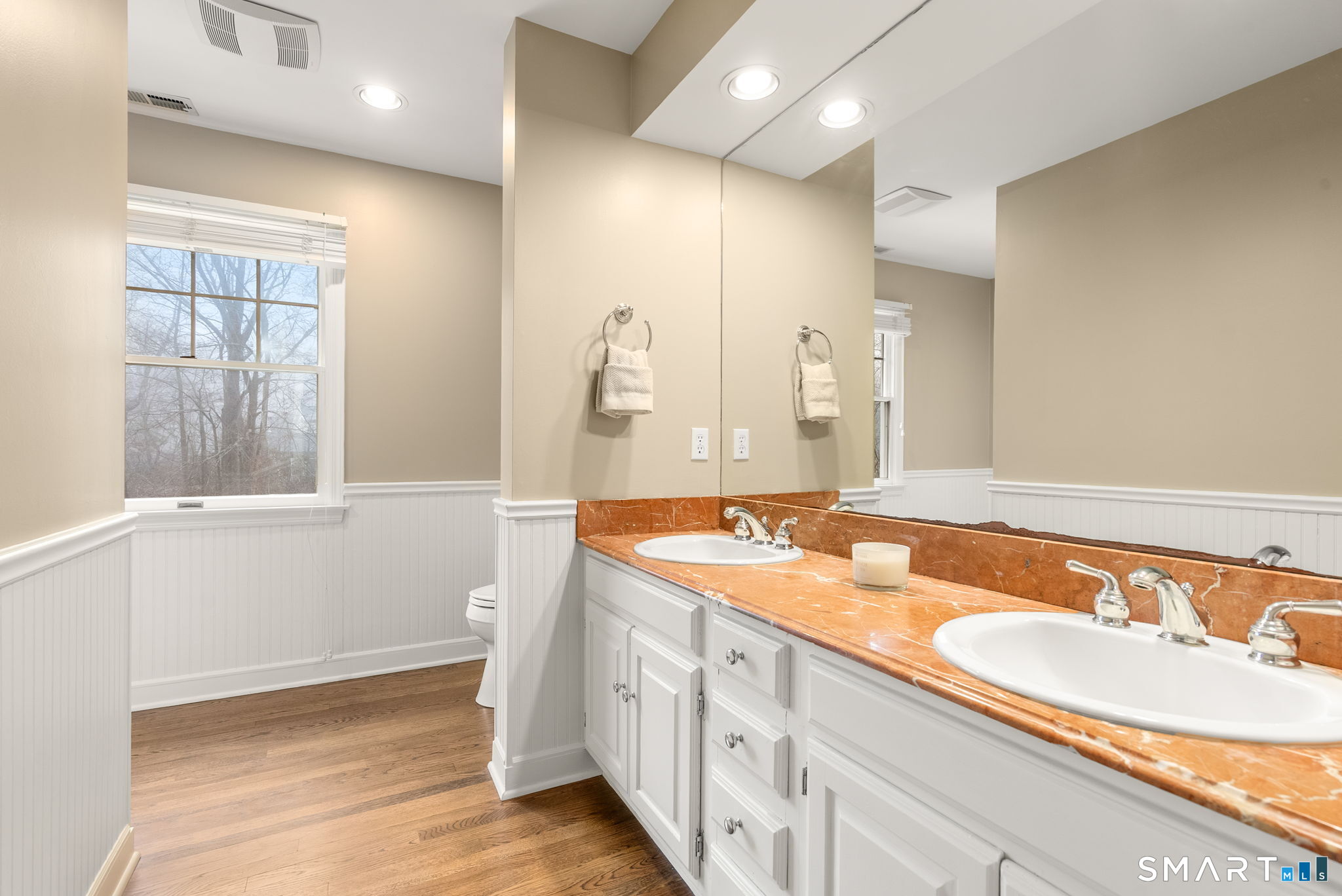 9 Pepperbush Road Weston, CT 06883 - Photo 34 of 48 a bathroom with a granite countertop sink and a large mirror