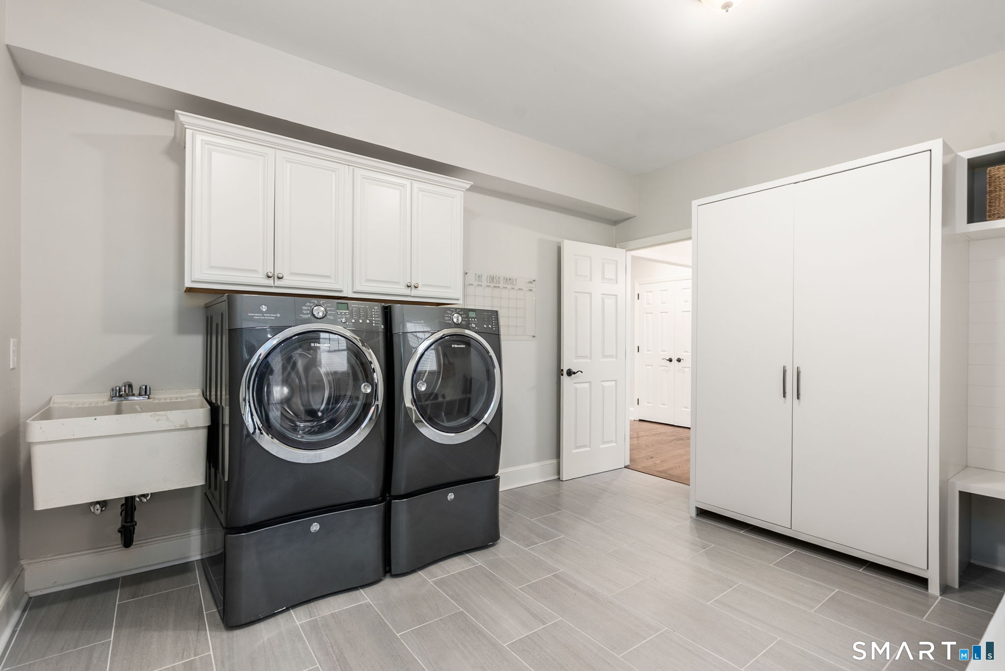 9 Pepperbush Road Weston, CT 06883 - Photo 38 of 48 a utility room with dryer and washer