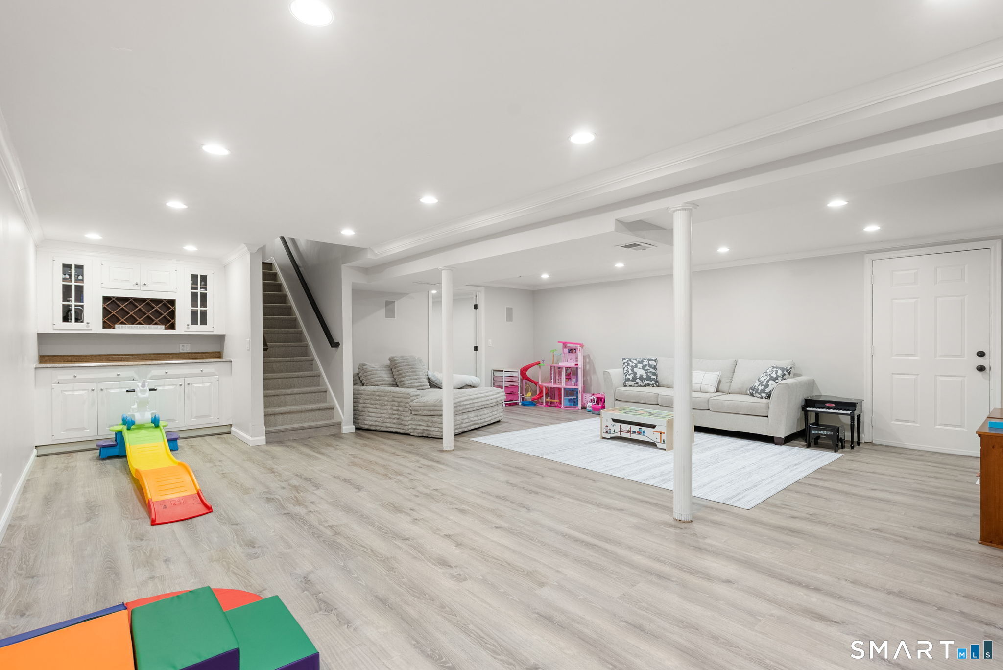 9 Pepperbush Road Weston, CT 06883 - Photo 39 of 48 a living room with furniture and kitchen view