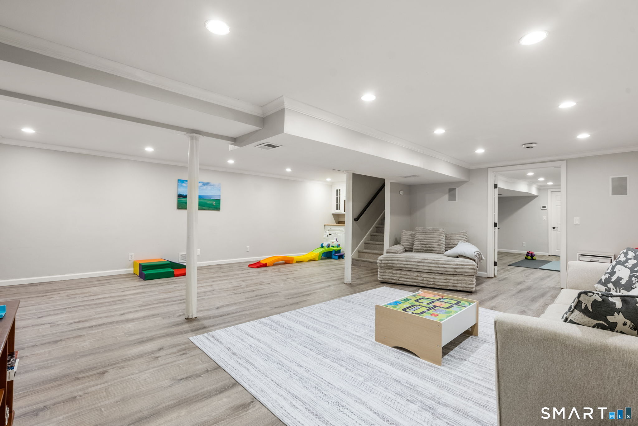 9 Pepperbush Road Weston, CT 06883 - Photo 40 of 48 a living room with furniture and a wooden floor