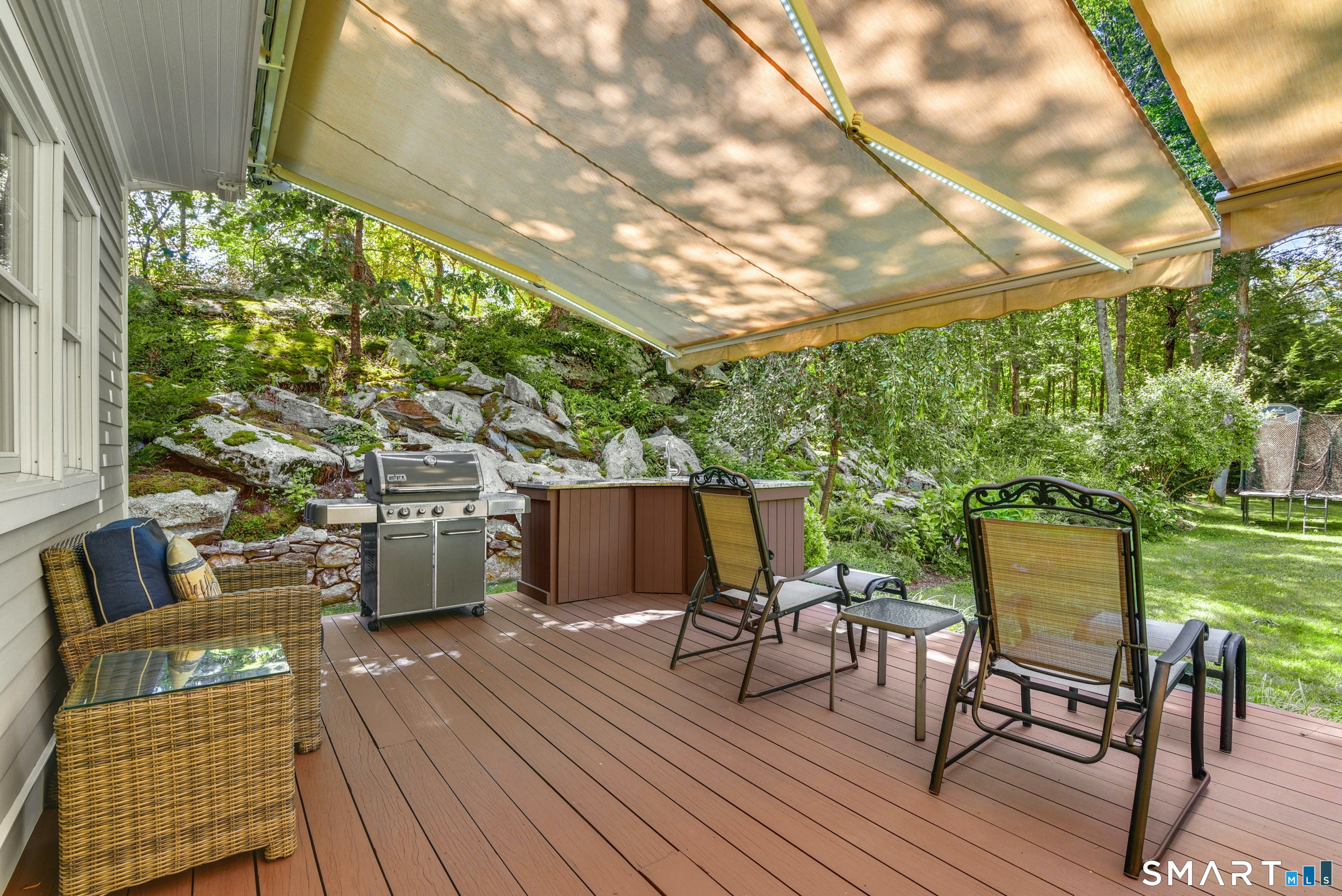 9 Pepperbush Road Weston, CT 06883 - Photo 4 of 48 a balcony with wooden floor table and chairs