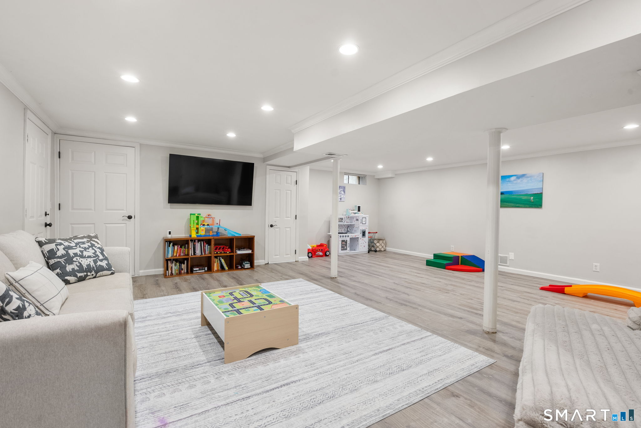 9 Pepperbush Road Weston, CT 06883 - Photo 41 of 48 a living room with furniture and a flat screen tv