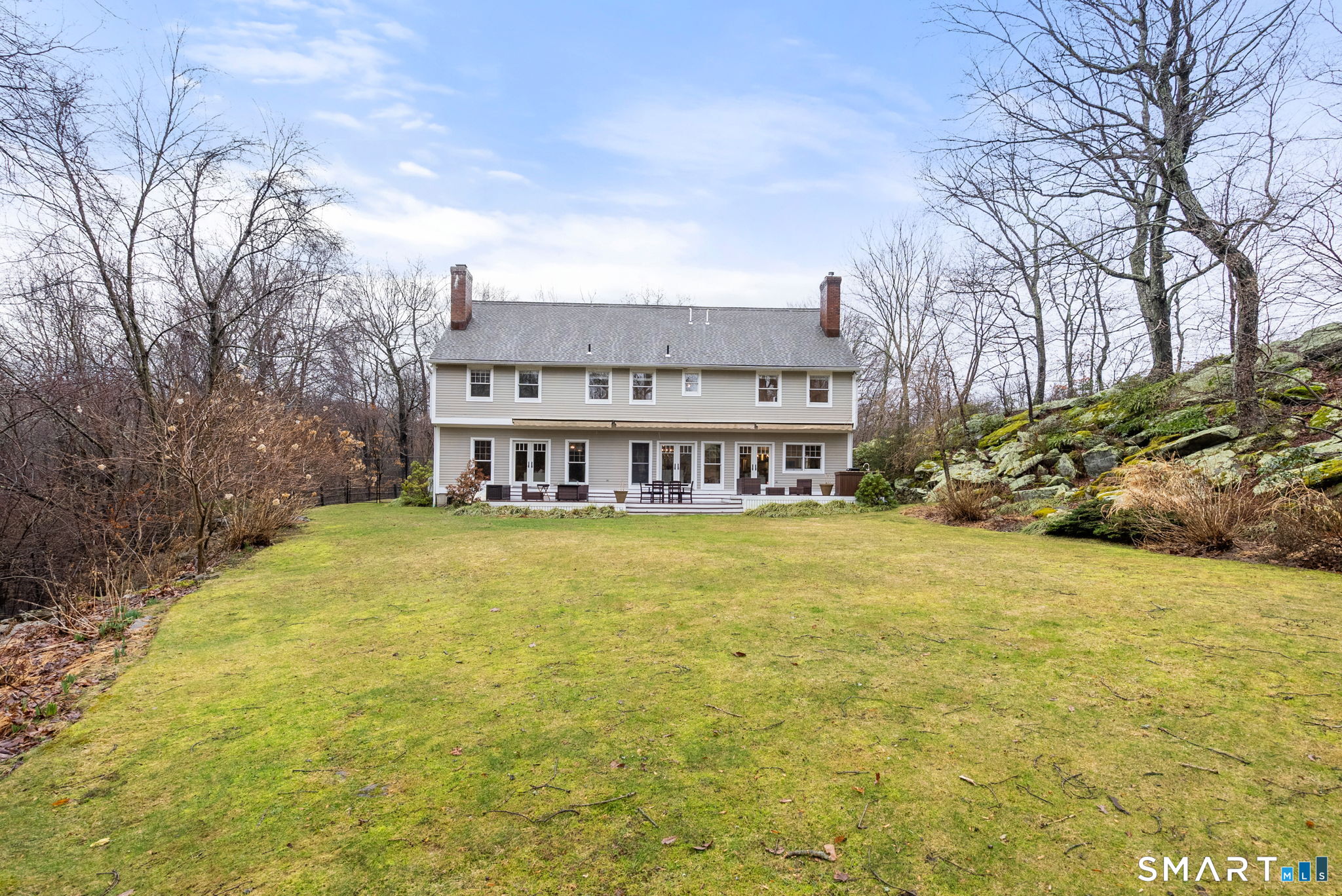 9 Pepperbush Road Weston, CT 06883 - Photo 44 of 48 a swimming pool with outdoor seating