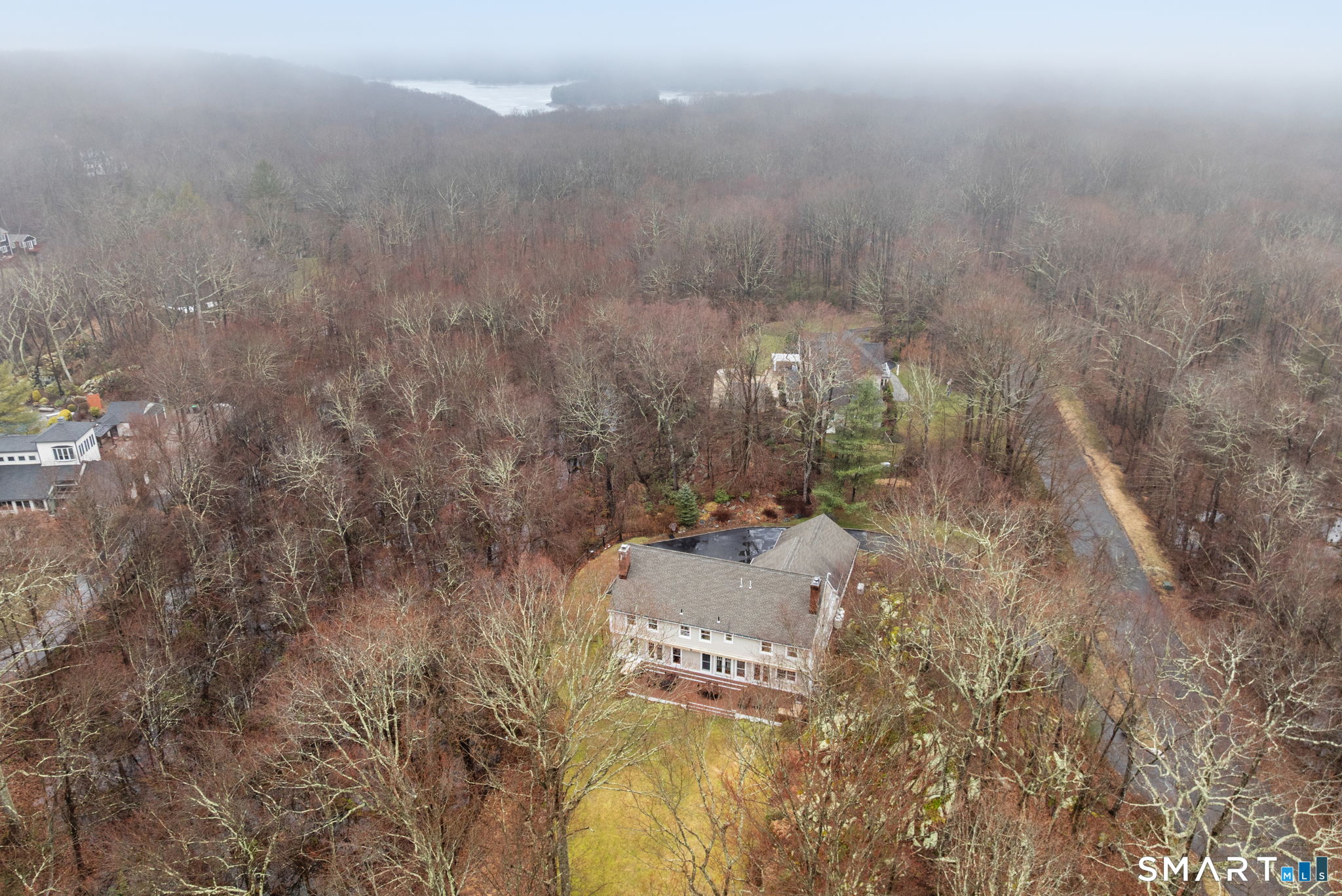 9 Pepperbush Road Weston, CT 06883 - Photo 46 of 48 a view of residential house and trees