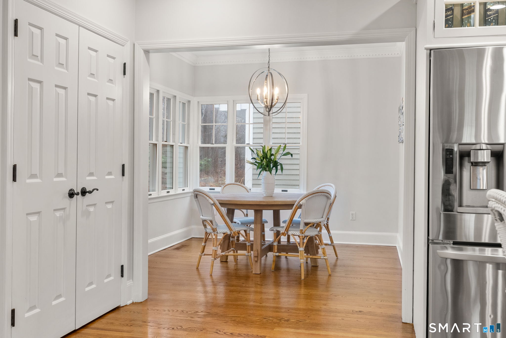 9 Pepperbush Road Weston, CT 06883 - Photo 5 of 48 a view of a dining room with furniture window and wooden floor