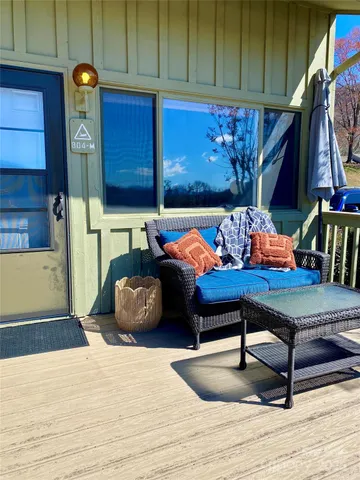 a bedroom with a bed and a potted plant