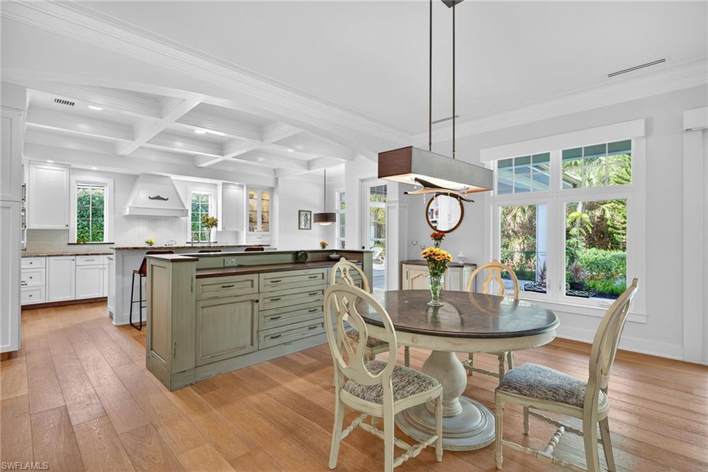 2305 Harrier Run Naples, FL 34105 - Photo 14 of 50 a view of a dining room with furniture window and wooden floor