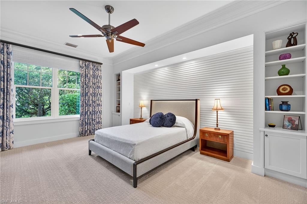 2305 Harrier Run Naples, FL 34105 - Photo 21 of 50 a living room with bed and a large window