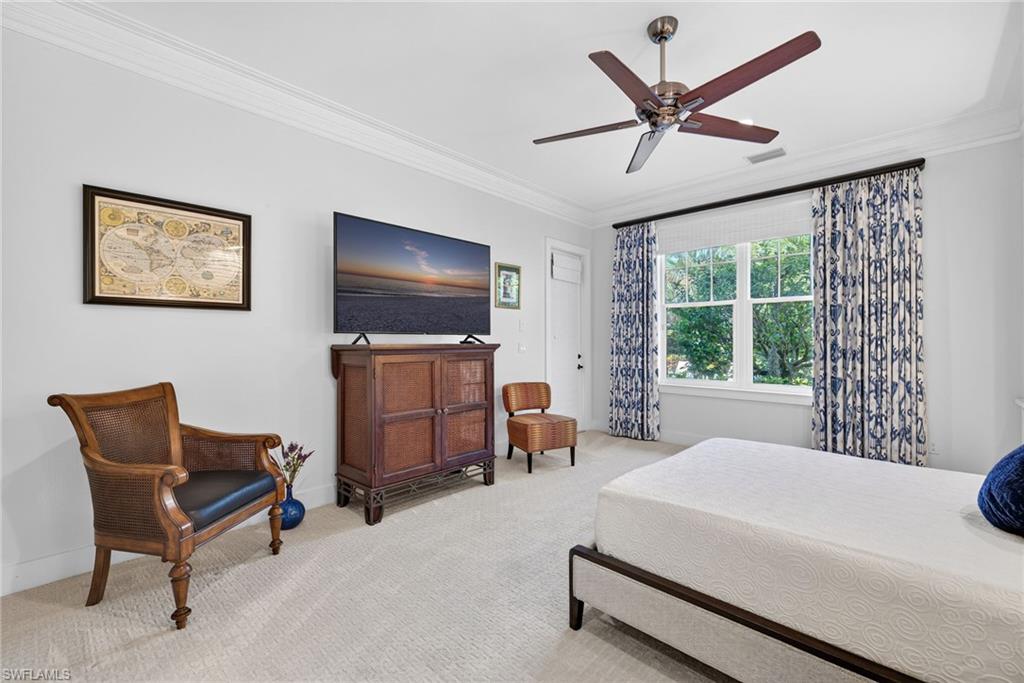 2305 Harrier Run Naples, FL 34105 - Photo 22 of 50 a living room with furniture and a flat screen tv