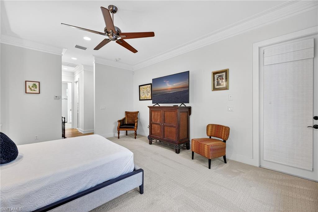 2305 Harrier Run Naples, FL 34105 - Photo 23 of 50 a bedroom with a bed and furniture