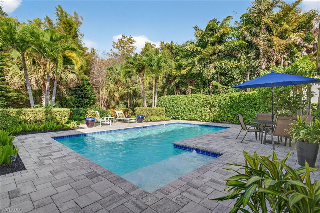 2305 Harrier Run Naples, FL 34105 - Photo 39 of 50 a view of a swimming pool with a patio