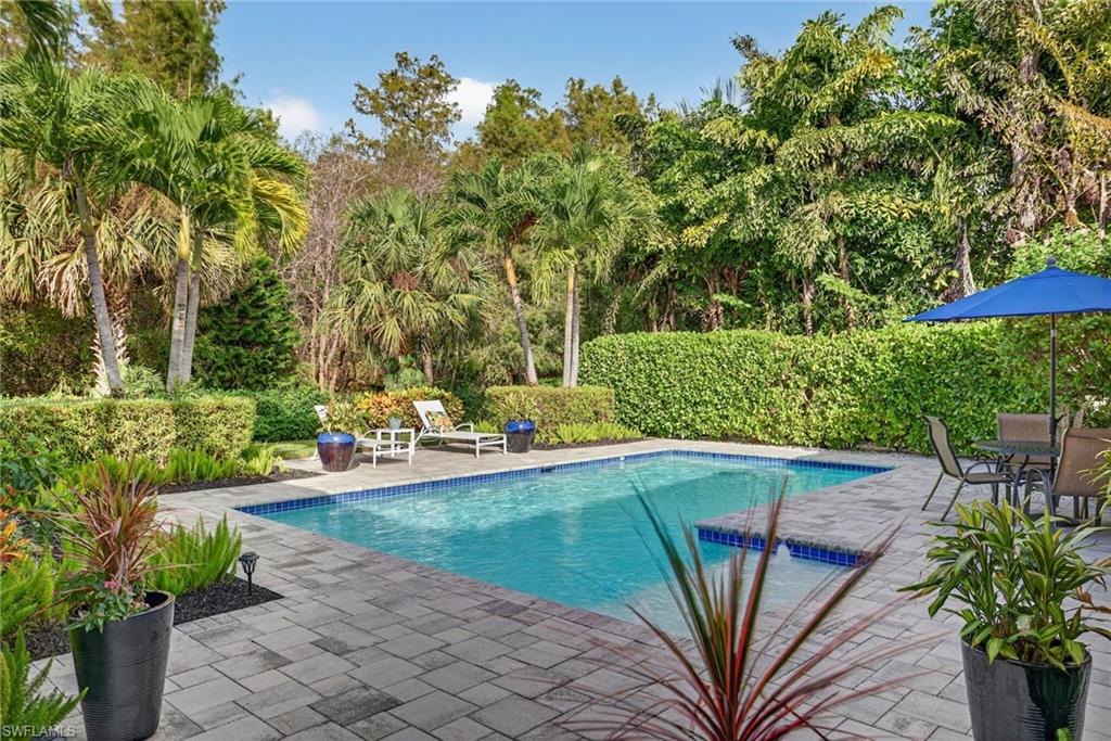 2305 Harrier Run Naples, FL 34105 - Photo 41 of 50 a view of a backyard with sitting area