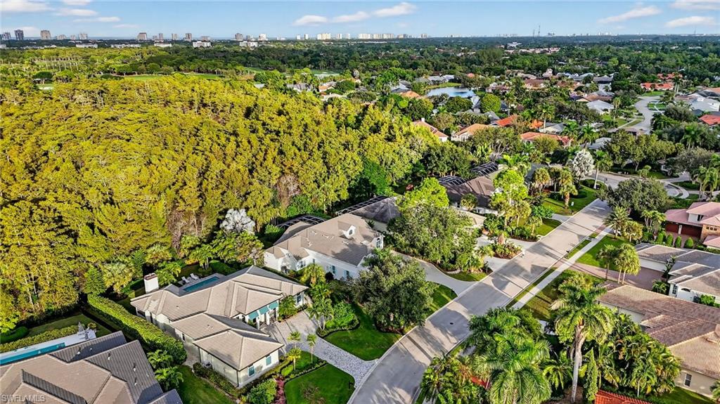 2305 Harrier Run Naples, FL 34105 - Photo 47 of 50 an aerial view of a house with a yard