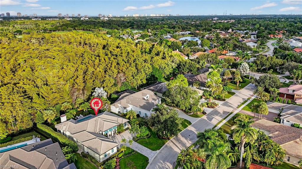 2305 Harrier Run Naples, FL 34105 - Photo 48 of 50 an aerial view of a house with a yard