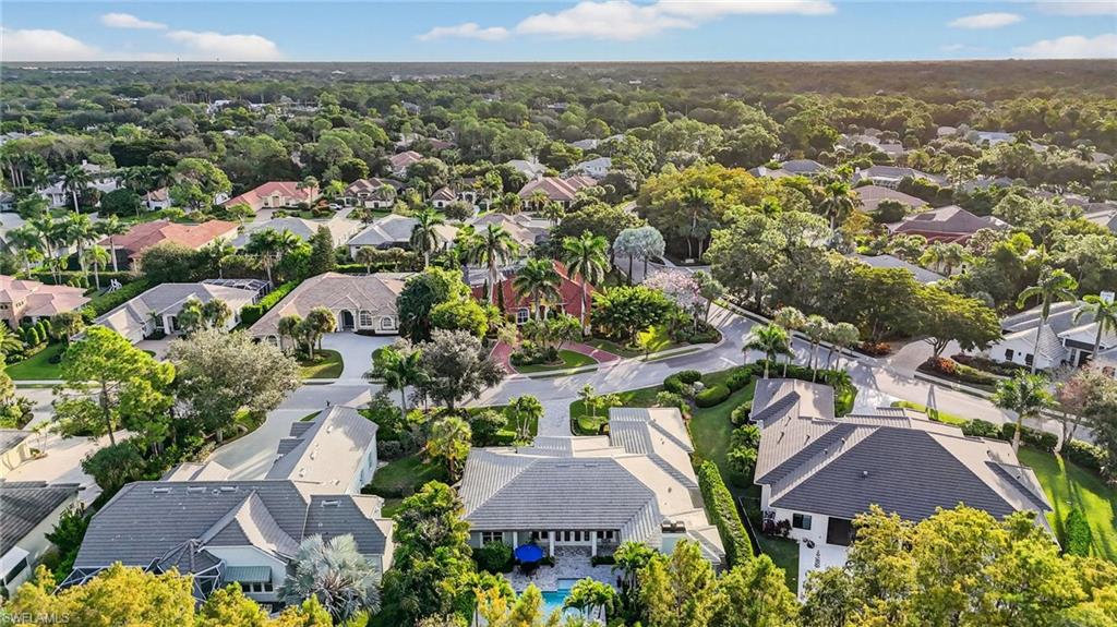 2305 Harrier Run Naples, FL 34105 - Photo 50 of 50 an aerial view of residential houses with outdoor space and trees