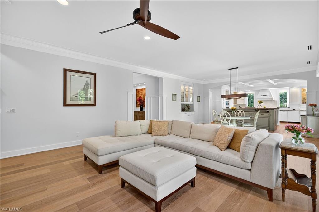 2305 Harrier Run Naples, FL 34105 - Photo 8 of 50 a living room with furniture and a wooden floor