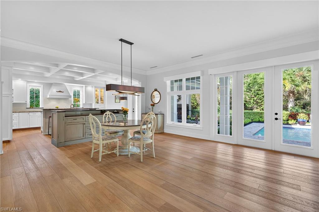 2305 Harrier Run Naples, FL 34105 - Photo 10 of 50 a dining room with furniture window wooden floor